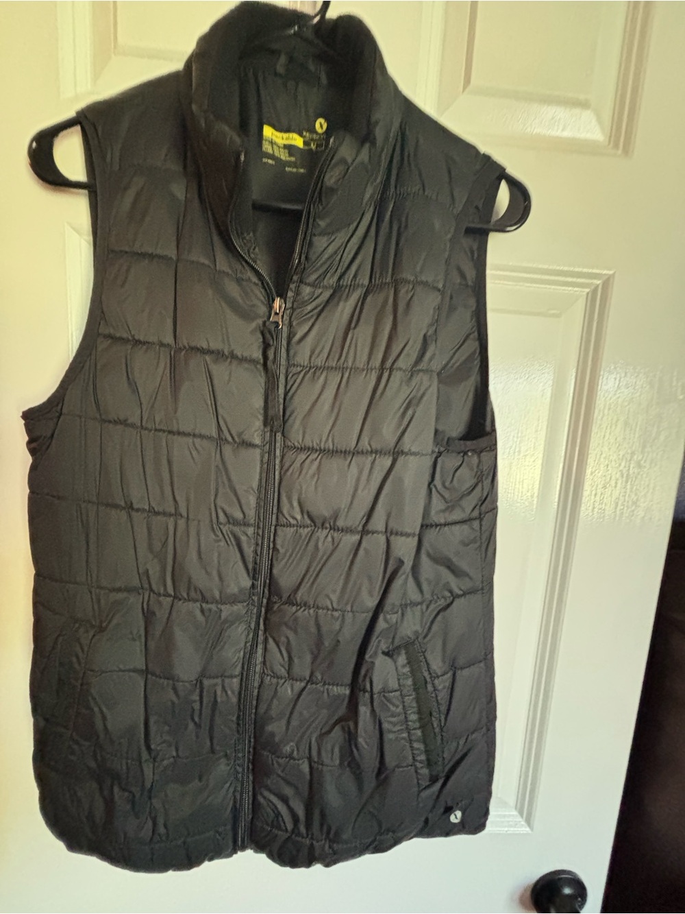 Xersion Black Packable Puffer Vest with fleece interior and zipper pockets.